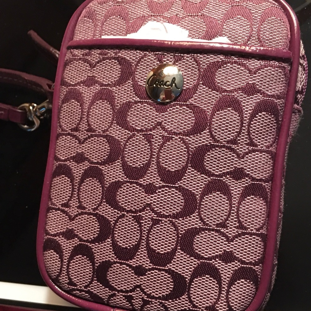 Small purple Coach messenger bag
